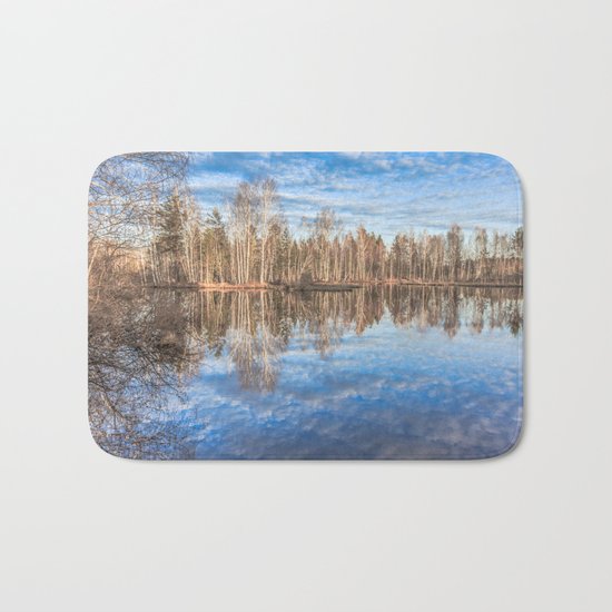 Sky reflection in a spring pond Bath Mat