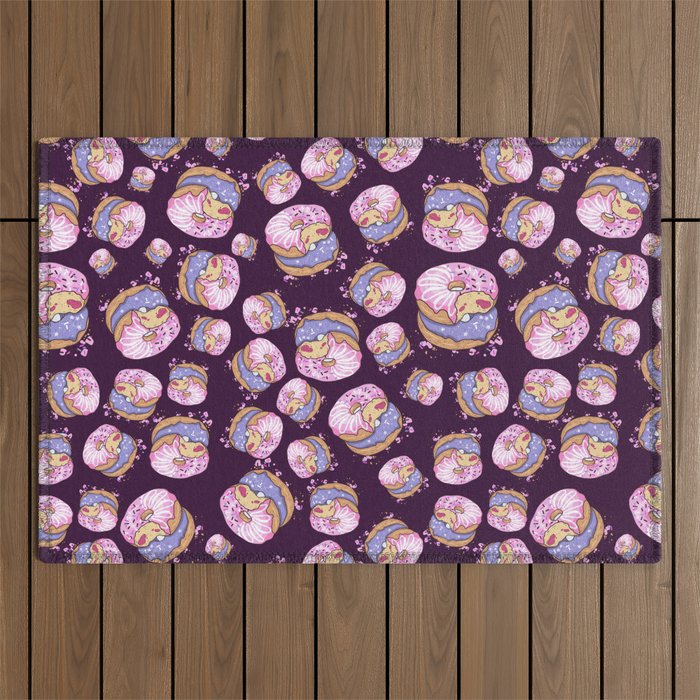 Pink donuts on a purple background Outdoor Rug