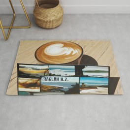 postcard from raglan new zealand with a coffee cup Rug