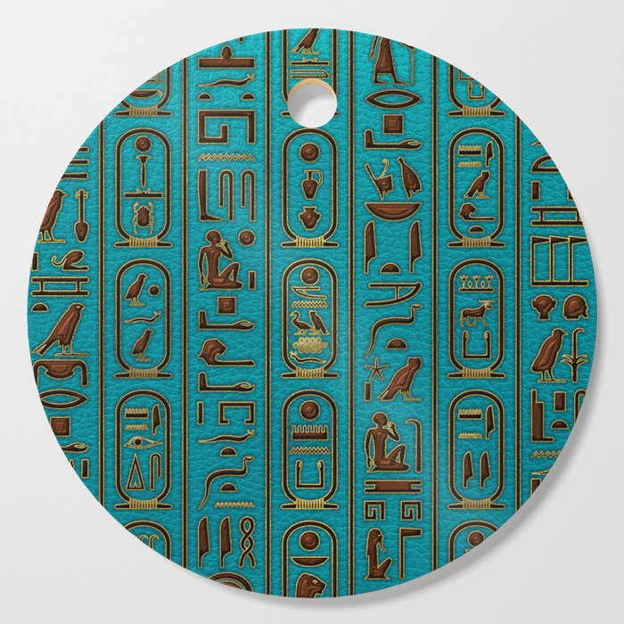 Egyptian Golden Leather hieroglyphs embossed on teal Cutting Board