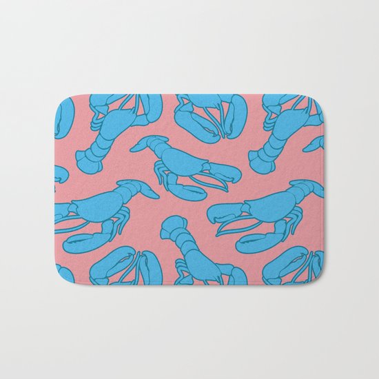 Blue lobsters on dusty pink. Bath Mat