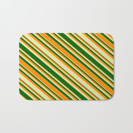 [ Thumbnail: Pale Goldenrod, Dark Green, and Dark Orange Colored Lined/Striped Pattern Bath Mat ]