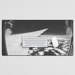 Airplane window and white clouds black and white Desk Mat