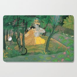 Radha and Krishna embrace in a grove of flowering trees Cutting Board
