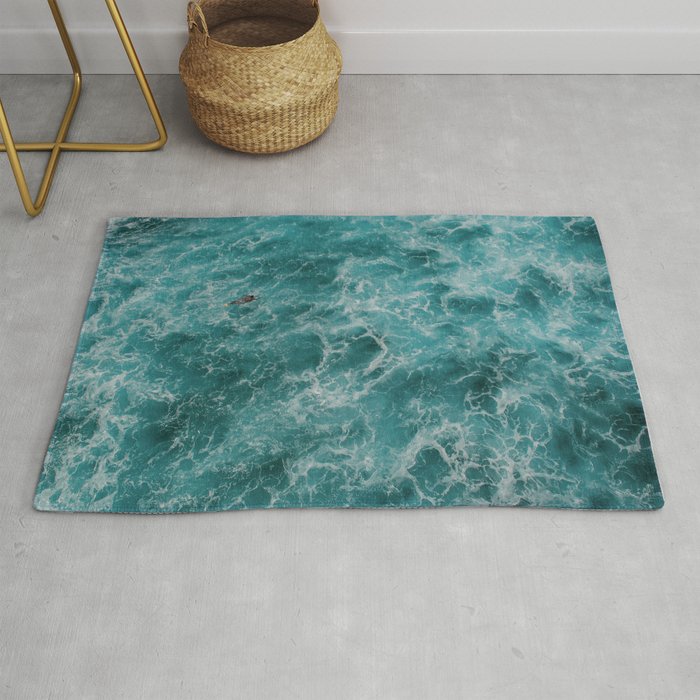 Surfer Paddling Out In The Water Rug