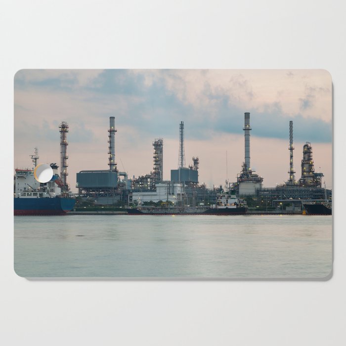 Oil refinery riverfront, vintage tone during sunrise Cutting Board