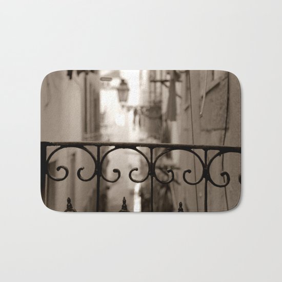 Lisbon street bokeh Bath Mat