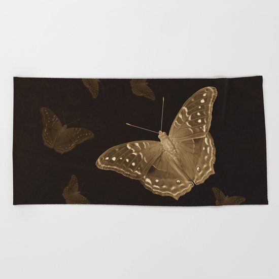 Butterflies in the dark Beach Towel