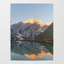 The Seekofel mountains and wooden boats reflected in the waters of Lake Braies Poster