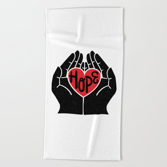 Hold hope in your heart Beach Towel
