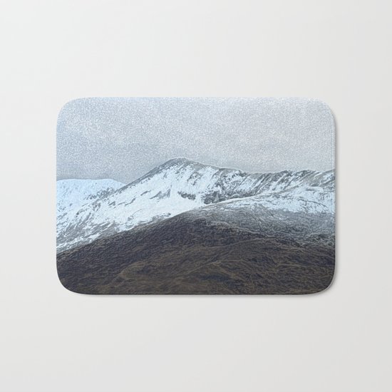 Off in the crouching mountains Bath Mat