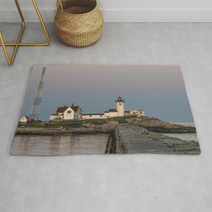 Eastern point lighthouse after sundown Rug