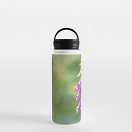 Beautiful purple foxglove flower against green background Water Bottle