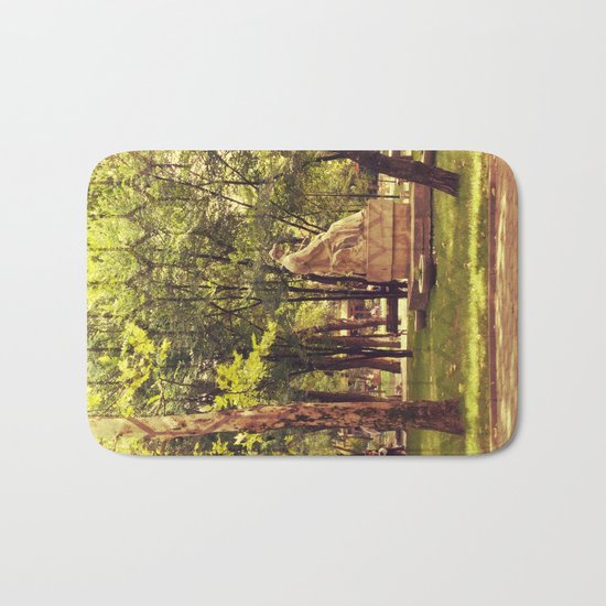 End of summer in park with trees and statue Bath Mat