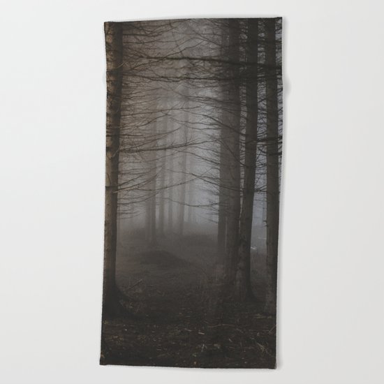 In the still forest Beach Towel