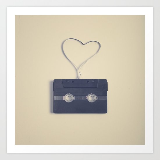 Retro black music cassette and heart shaped tape on beige background Art Print