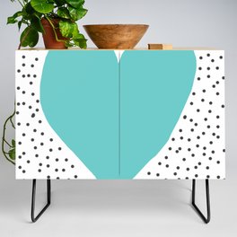 Turquoise heart with grey dots around Credenza