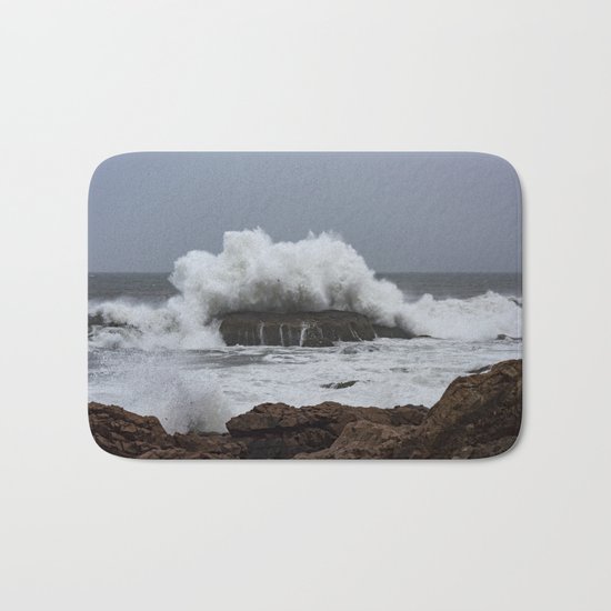 Wave splashing on the rocks Bath Mat