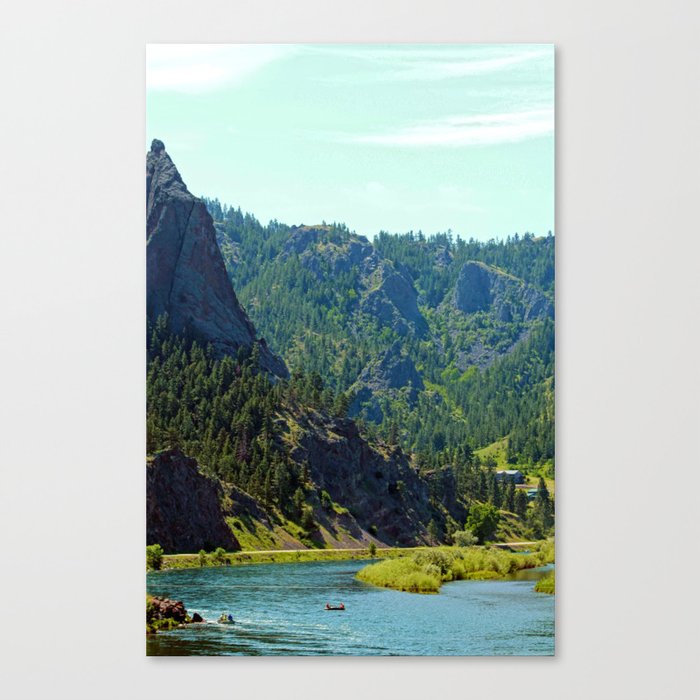 Canoe between the mountains Canvas Print