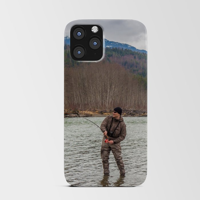 A fly fisherman hooked into a big fish in a the Kalum River, British Columbia, Canada, with the rod bent and aspen woodland on the far bank, and mountains in the background iPhone Card Case