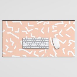 Squiggles in white on peach Desk Mat