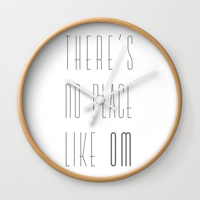 There's no place like OM Wall Clock by lasegunda | Society6