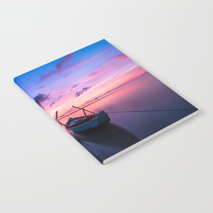 Boat on a lake with sunrise Notebook