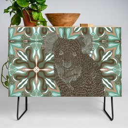 Sweet Koala bear sitting on a green and brown patterned background Credenza