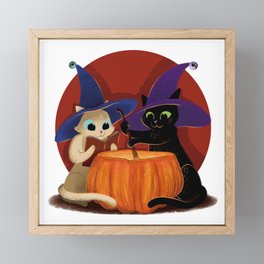 Witch cats with a cauldron pumpkin Framed Mini Art Print