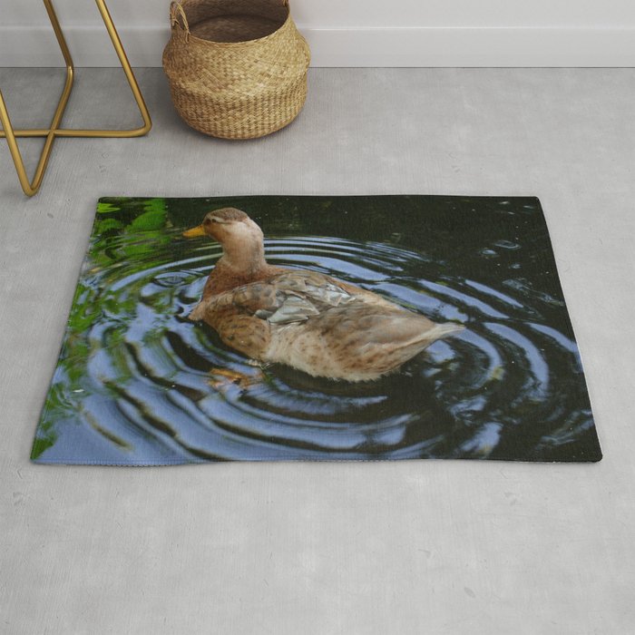 Female Duck Shaking Tail Feathers And Water Ripples Rug By Taiche Society6