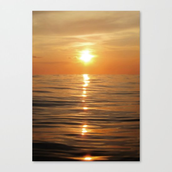 Sun setting over calm waters Canvas Print