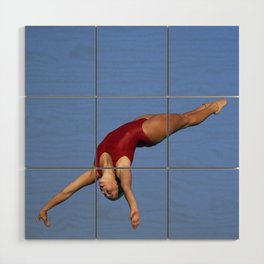 Woman diver flying through the air. Wood Wall Art