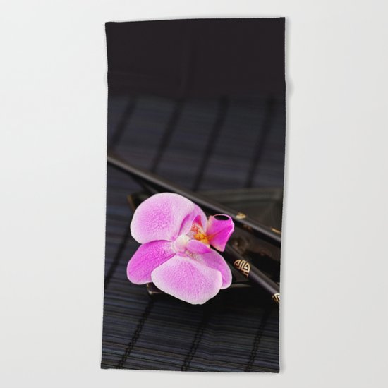 Zen pink Orchid flower on black Beach Towel