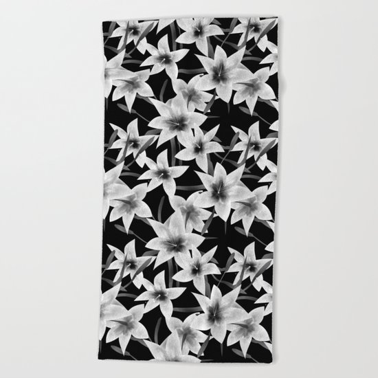 White lilies on a black background . Beach Towel