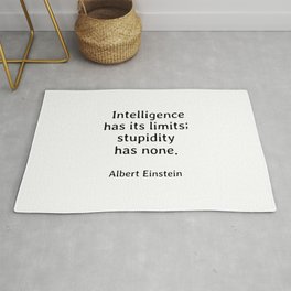 Albert Einstein funny quote -  Intelligence has its limits while stupidity has none Rug