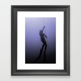 Freediver ascends. Framed Art Print