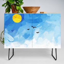 a flight of swallows in a beautiful blue sky Credenza