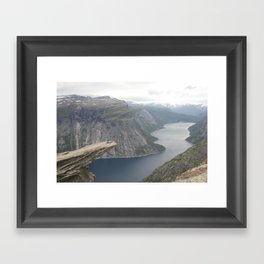Laying on the edge of the world Framed Art Print