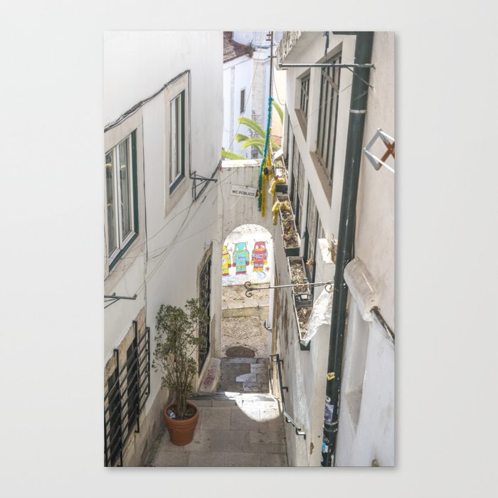 Alley in Lisbon Portugal with colorful streetart - martians in the mediterranean - travel and street photography Canvas Print