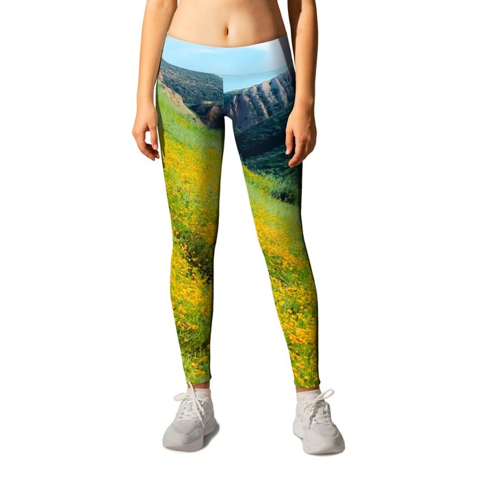 yellow poppy flower field with green leaf and green mountain and cloudy blue sky in summer Leggings