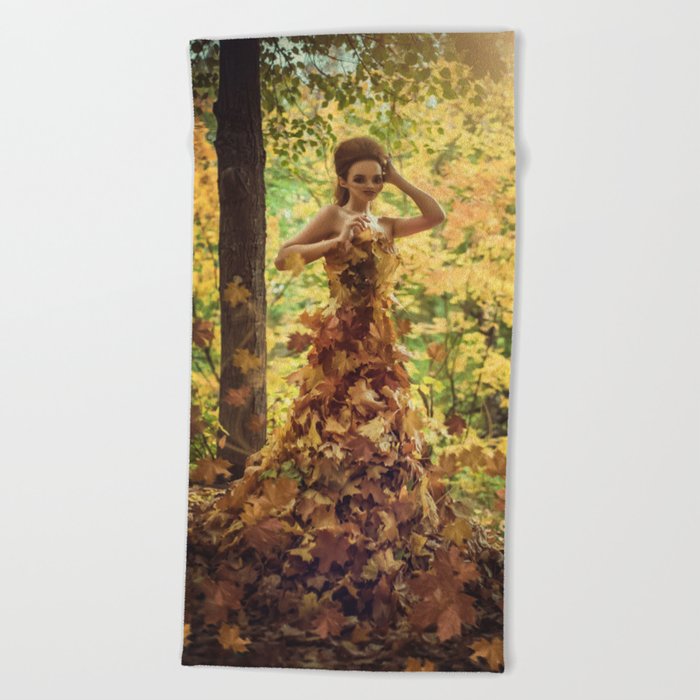 Autumn leaves; female wearing gown dress of leaves magical realism fantasy color portrait photograph / photograph  Beach Towel