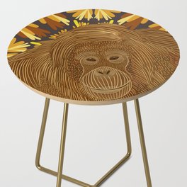 Orangutan in the jungle sitting on a brown abstract leafy pattern background Side Table
