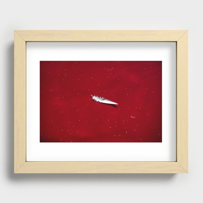 feather floating in red bloody water abstract beautiful surreal shot Recessed Framed Print