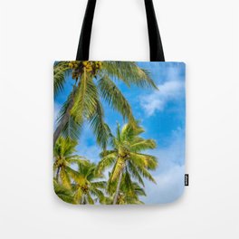 Coconut Palm Trees against the blue sky at Isle of Pines in New Caledonia. Tote Bag