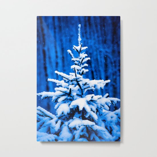 Snow covered Christmas tree Metal Print