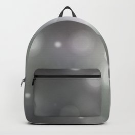 Bokeh light, shimmering blur spot lights on silver abstract background. Backpack