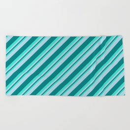 [ Thumbnail: Turquoise, Light Blue & Teal Colored Lined Pattern Beach Towel ]