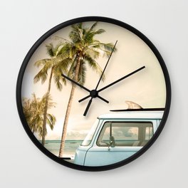 Vintage car parked on the tropical beach (seaside) with a surfboard on the roof Wall Clock