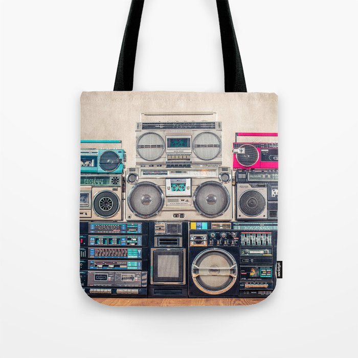 Retro old school design ghetto blaster stereo radio cassette tape recorders boombox tower from circa 1980s front concrete wall background. Vintage style filtered photo Tote Bag