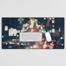 Blurred background. Night city lights blur. Retro toned photo, vintage. Desk Mat